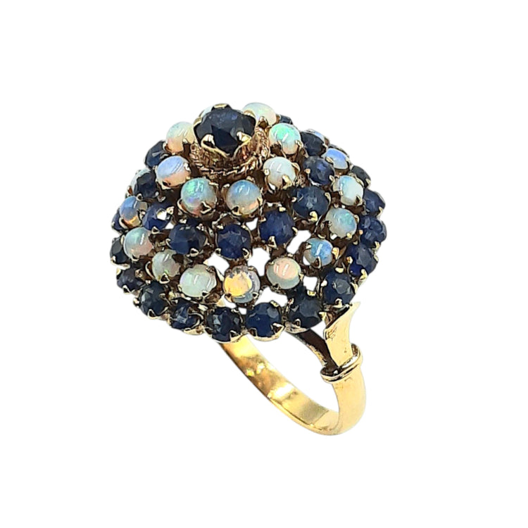 APPRAISED $1000- 14KT Yellow Gold Dome Style Ring with 1 Round Sapphire Center Stone (3.5MM) Surrounded by 24 Round Opals (2.2MM) and 32 Round Sapphires (2-2.5MM) Set into 4 Halos