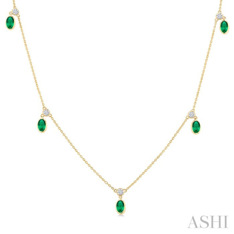 5x3 MM Oval Shape Emerald and 1/8 Ctw Round Cut Diamonds Precious Station Necklace in 10K Yellow Gold