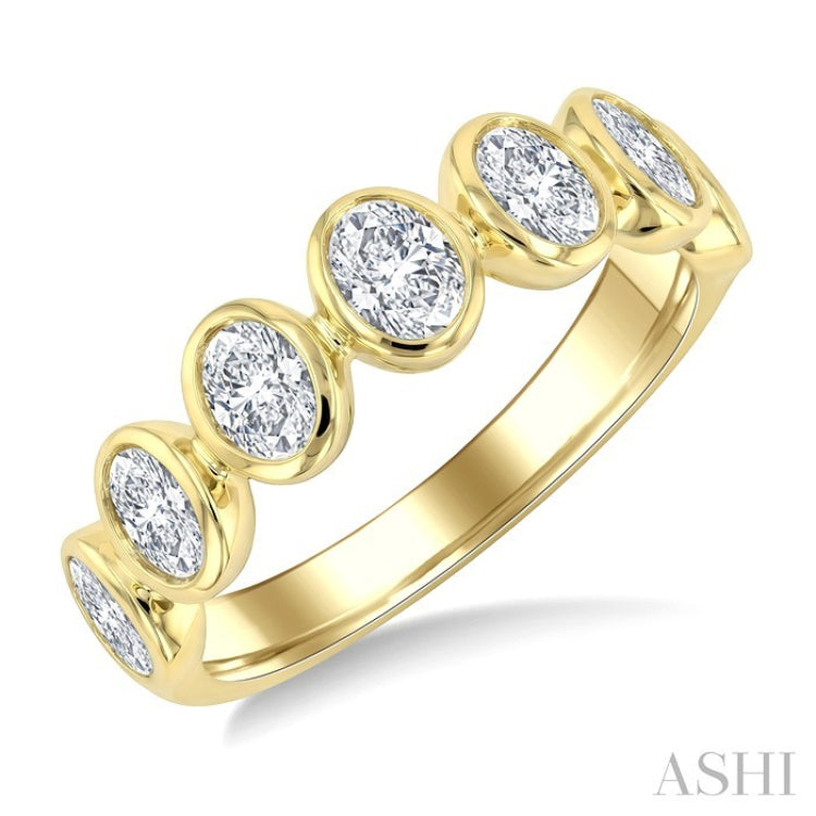 1 1/4 Ctw 7 Stone Bezel Set Oval Cut Diamond Fashion Band in 14K Yellow Gold