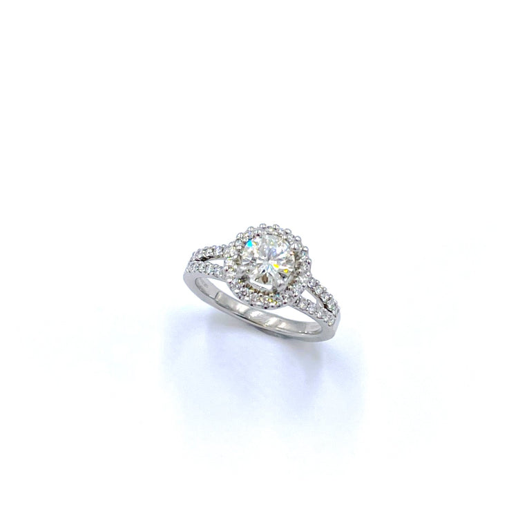 APPRAISED $9400- 14Kt. White Gold Ring with One Round Brilliant Diamond Accented by Forty-Eight Round Brilliant Diamonds in a Halo with a Split Shank Design
