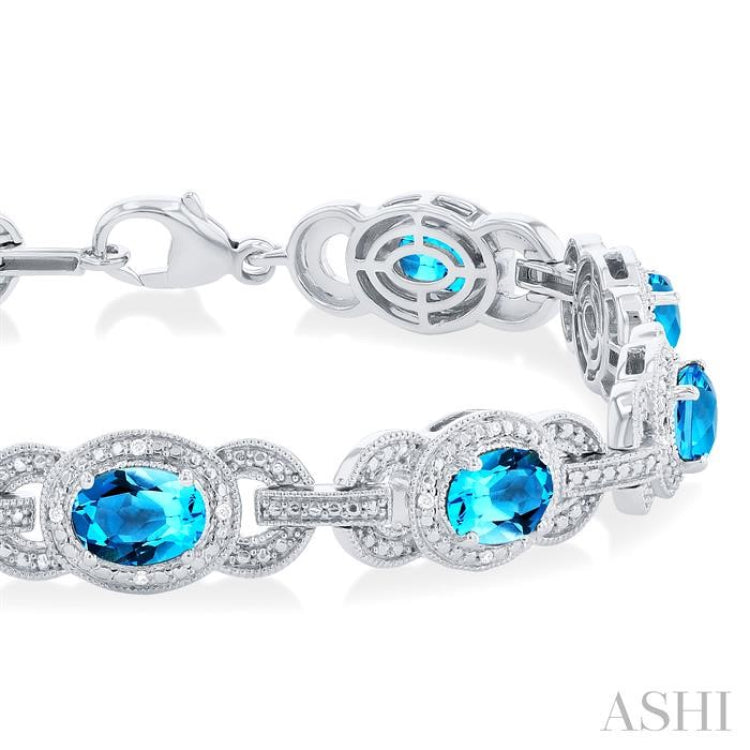 7x5 MM Oval Shape Blue Topaz and 1/10 Ctw Round Cut Diamond Semi-Precious Bracelet in Sterling Silver