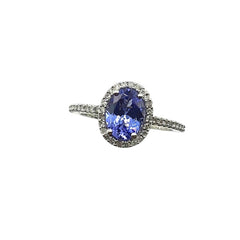 APPRAISED $1500 - 14kt White Gold Band with Oval Tanzanite surrounded by 48 .24ct Single Cut Diamonds in a Halo Design Along Sides