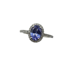 APPRAISED $1500 - 14kt White Gold Band with Oval Tanzanite surrounded by 48 .24ct Single Cut Diamonds in a Halo Design Along Sides