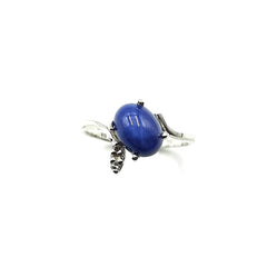 APPRAISED $400 - 14kt White Gold Band with an Oval Shaped Synthetic Star Sapphire Center (8x6mm) with 2 Single Cut Diamonds - T - .03ct on the sides