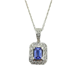 APPRAISED $1600- 18Kt. White Gold Pendant with One Emerald Cut Tanzanite Surrounded by Twenty-Three Diamonds in a Halo Milgrain Design