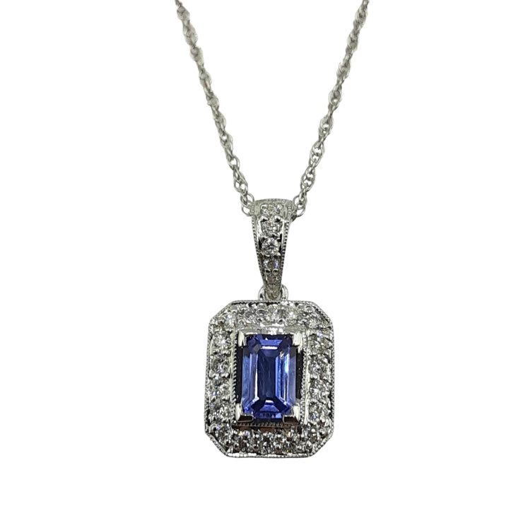 APPRAISED $1600- 18Kt. White Gold Pendant with One Emerald Cut Tanzanite Surrounded by Twenty-Three Diamonds in a Halo Milgrain Design