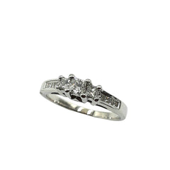 APPRAISED $1100 - 14kt White Gold Band with 1 Princess Diamond Center - EST. - .20ct and 8 Princess Diamonds - T. - .13ct in a Channel Set and 2 Princess Diamonds - T. - .02ct Bezel Set on Sides 