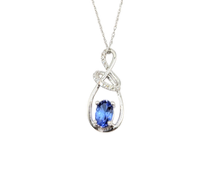 APPRAISED $1610- 14KT White Gold Pendant with an Oval Tanzanite & Diamonds Accents Set in a Swirl Design