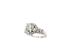 APPRAISED $8150- 18KT White Gold Engagement Ring with a Round Brilliant Diamond surrounded by Rounds Brilliant Diamonds in a Halo Design