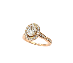 APPRAISED $3600- 14KT Rose Gold Engagement Ring with a Round Brilliant Diamond surrounded by Round Brilliant Diamonds in a Halo Design
