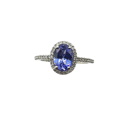 APPRAISED $1500 - 14KT White Gold Band with Oval Tanzanite surrounded by 48 .24ct Single Cut Diamonds in a Halo Design Along Sides