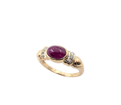 APPRAISED $550- 14KT Yellow Gold Ring with a Bezel Set Oval Cabochon Ruby surrounded by Round Brilliant Diamonds
