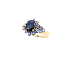 APPRAISED $900- 10KT Yellow Gold Ring with an Oval Sapphire surrounded by Round Sapphires