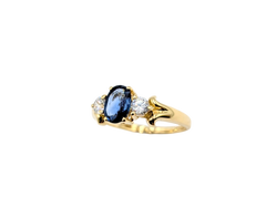 APPRAISED $600- 14KT Yellow Gold Ring with an Oval Sapphire & Round Cubic Zirconia on the sides