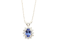 APPRAISED $1000- 14KT White Gold Pendant with a Oval Tanzanite surrounded by Round Brilliant Diamonds in a Halo Design