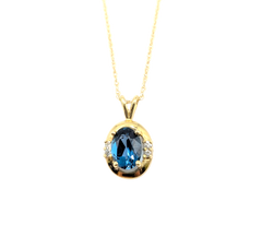 APPRAISED $850-14KT Yellow Gold Pendant with an Oval Blue Topaz & Round Brilliant Diamonds