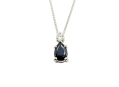 APPRAISED $1800- 10KT White Gold Pendant with a Pear-Shape Sapphire & a Round Brilliant Diamond